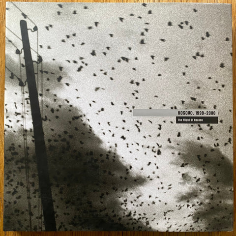 The photography book cover of Kosvo, 1999-2000. The Flight of Reason by Paolo pellegrin. In hardcover with dust jacket with text and image.