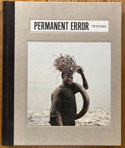 The photobook cover of Permanent Error by Pieter Hugo. In hardcover grey.