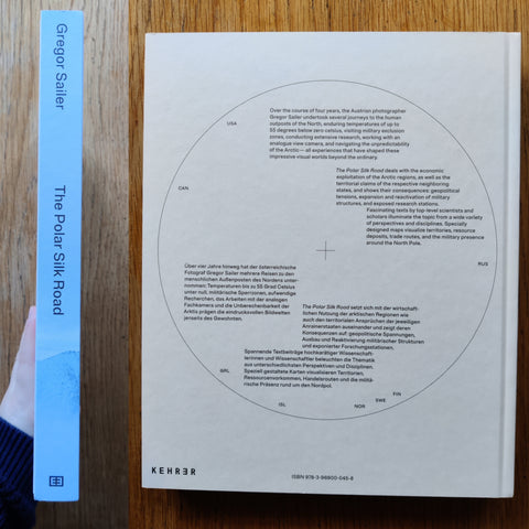 The photography book cover of The Polar Silk Road by Gregor Sailer. In hardcover blue.