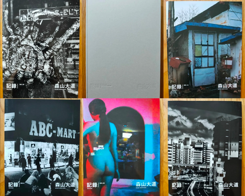 The photography book covers of Daido Moriyama's Record. Large format paperbacks. Signed.