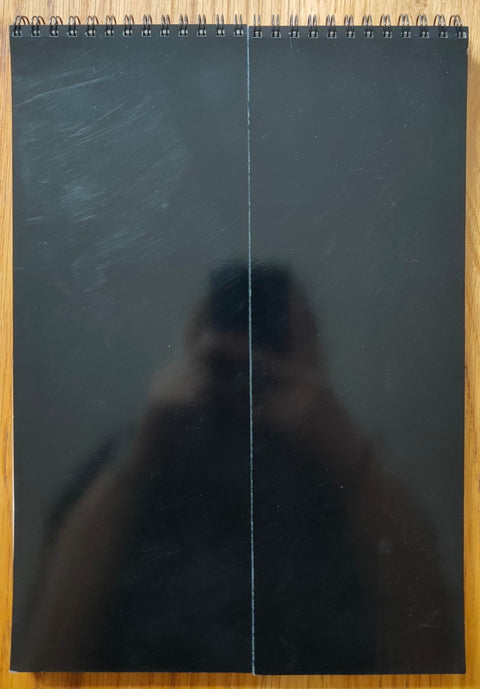 The photography book cover of TEIKAI: Wandering at Midnight by Daisuke Yokota. Paperback in shiny black.