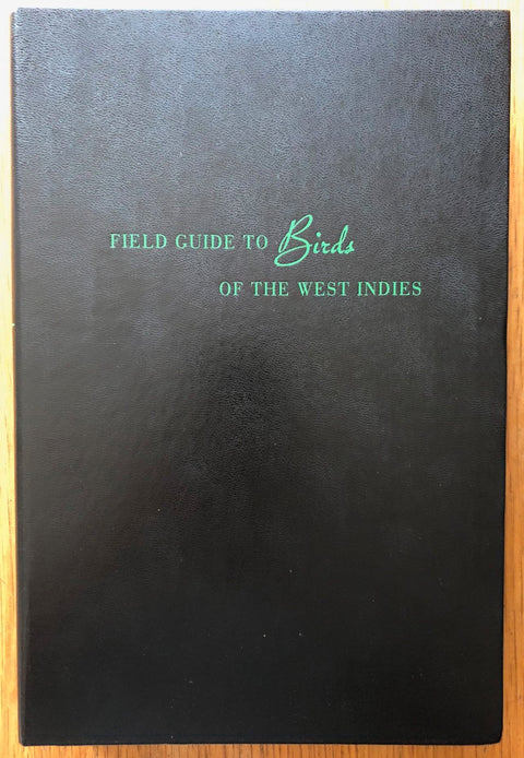 The photography book cover of Field Guide to Birds of the West Indies by Taryn Simon. Hardback in black with green text.