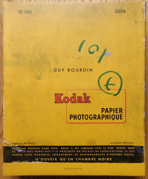 The photography book cover of Untouched by Guy Bourdin. Hardback in yellow with a "Kodak" sign in the middle.
