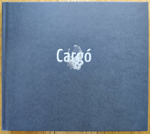 The photobook cover of Cargó by Igor Posner . In hardcover black with a white fingerprint.