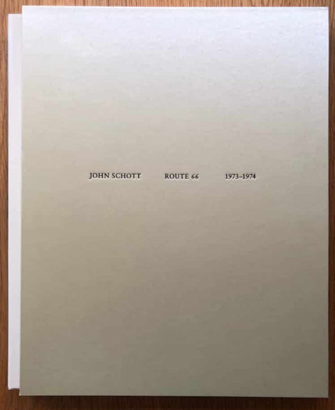 The photography book cover of Route 66 1973 -1974 by John Schott. Hardback in grey/beige.