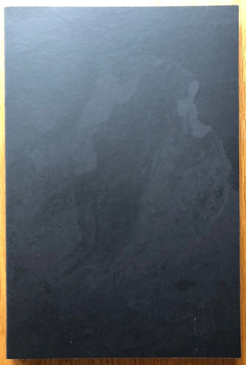 The photography book cover of Nothing but Clouds by Kristina Jurotschkin. Paperback black cover.