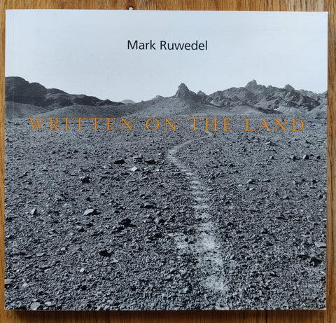 The photography book cover of Written on the Land by Mark Ruwedel. In softcover black and white.