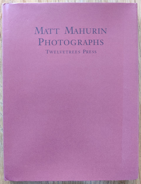 The photography book cover of Photographs by Matt Mahurin. In dust jacketed hardcover dark red.