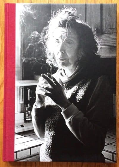 The photography book cover of Mother by Matthew Finn. Hardback black and white cover photo with red binding.