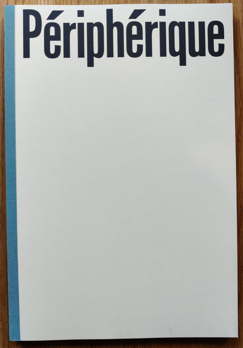 The photography book cover of Peripherique by Mohamed Bourouissa. In paperback white and red with blue spine.