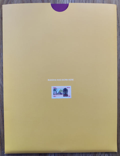 The photobook cover of Buddha Was Born Here by Olgac Bozalp. In a yellow slipcase.