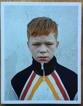 The photography book cover of Paddy & Liam by Perry Ogden. Paperback with image of boy on cover.