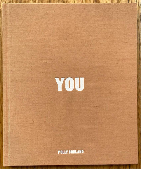 The photography book cover of You by Polly Borland. Hardback in orange/brown.