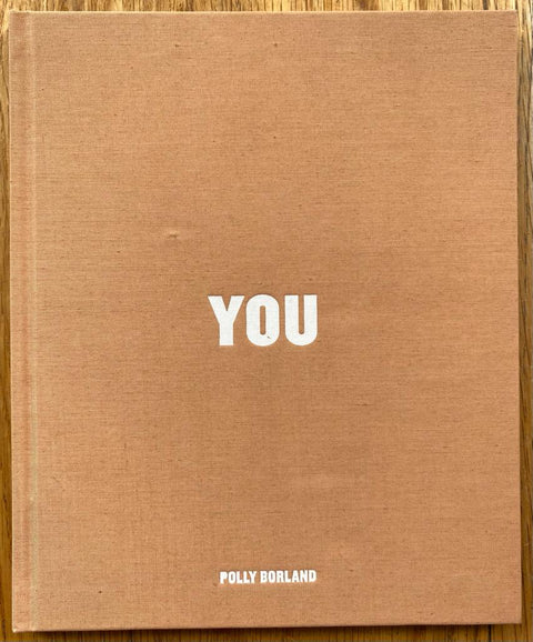 The photography book cover of You by Polly Borland. Hardback in orange/brown. 
