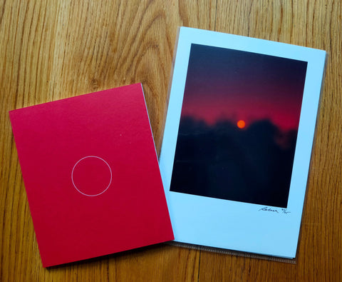 The photography book cover of Inner/Visions by Robin Ek. Paperback in red with a white circle in the centre. Signed.