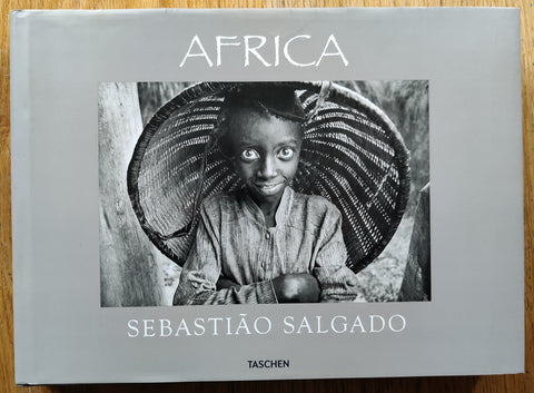 The photobook cover of Africa by Sebastiao Salgado. In dust jacketed hardcover black.