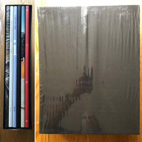 The photography book cover of SIX BY SIX | Set 4: Sally, Monegros, Blue, The Middle of somewhere, a new american picture, sparrow island. Set of 6 hardback books inside a black slipcase.