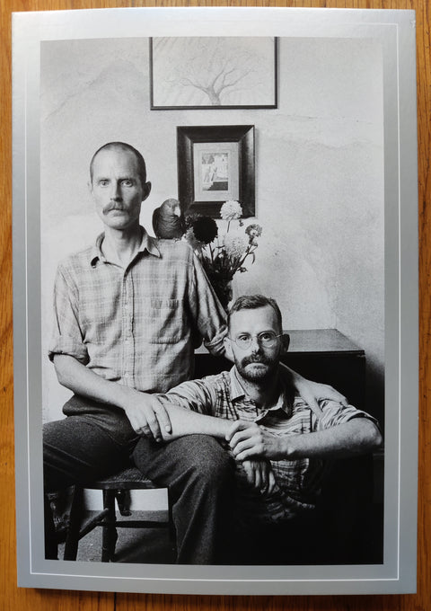 The photography book cover of Lovers: Ten Years On by Sunil Gupta, In softcover grey with a black and white photo