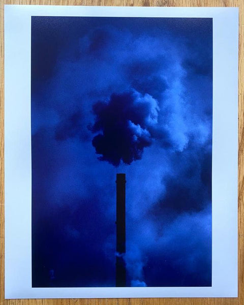 The print for Crimson Line by Trent Parke. Hardback colourful book. Blue print of smoke. Signed.