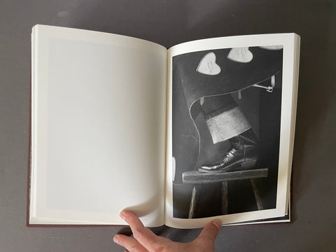 Black and white image of cowboy boots. 
