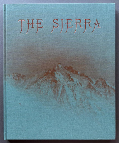 Book titled 'The Sierra' by Aaron Rothman with a blue cover and the image of a mountian.