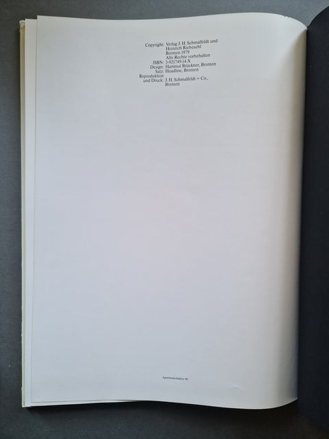 An open book showing printed copyright text at the top