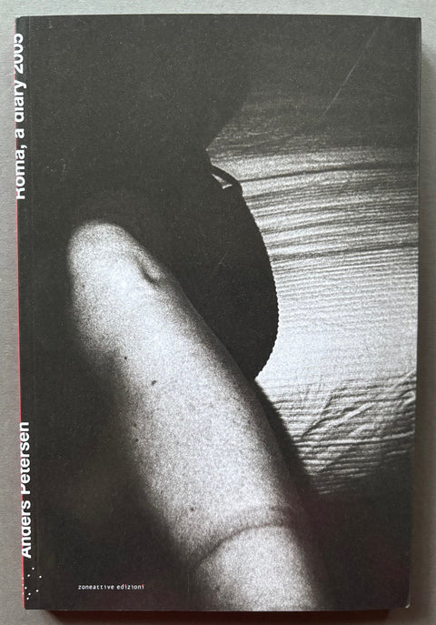 Book titled 'Roma, A Diary 2005' y Anders Petersen with a cover of a black and white image of an arm.