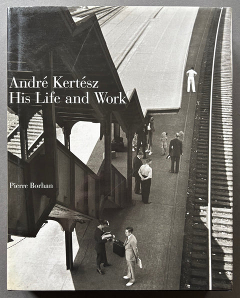 Book titled 'Andre Kertesz: His Life and Work' with a cover featuring a photograph of people standing on a train platform.