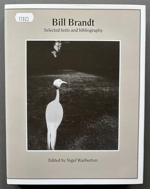 Book titled 'Bill Brandt: Selected texts and bibliography' by Nigel Warburton with a grey cover including a black and white image of a crane.