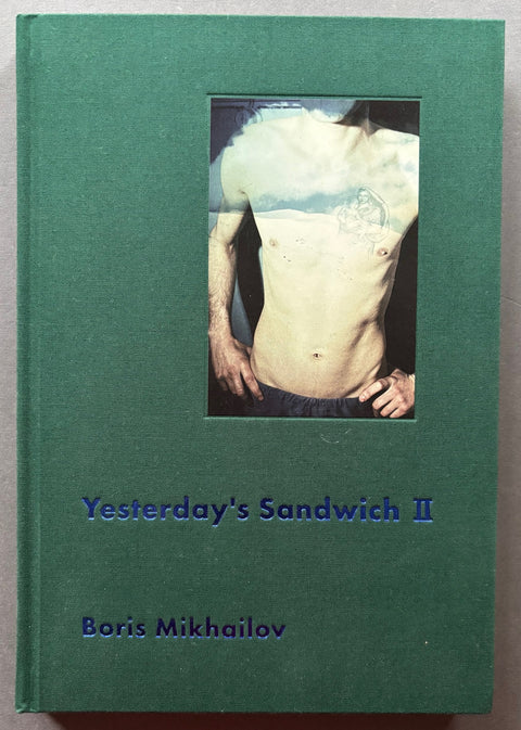 Book titled 'Yesterday's Sandiwich II' by Boris Mikhailov with a green cover featuring the image of the naked torso of a man.