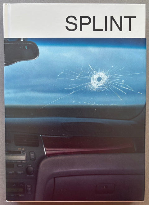 Book titled 'Splint' by Chessa Subbiondo with a cover featuring the image of a hole in a car windscreen.