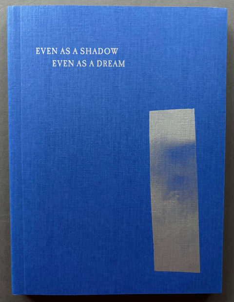 Book titled 'Even As A Shadow, Even As A Dream' by Chloe Zhao, Jessie Buckley and Agata Grzybowska with a blue cover.