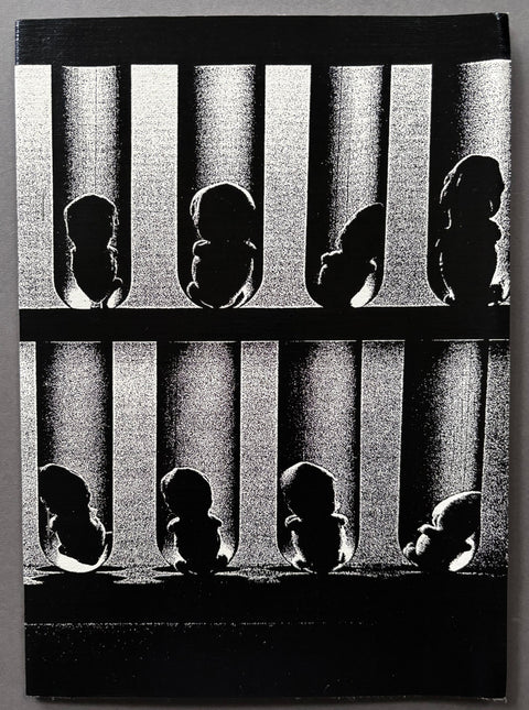 Book titled 'Pantomime' by Daido Moriyama with a cover of a black and white image of fetuses in test tubes.