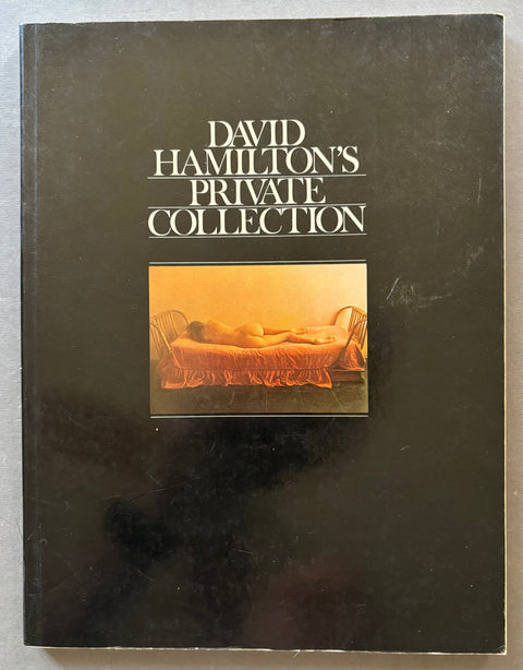 A hardcover book titled 'David Hamilton's Private Collection' with a black cover and a central warm-toned photograph, photographed against a light gray background.