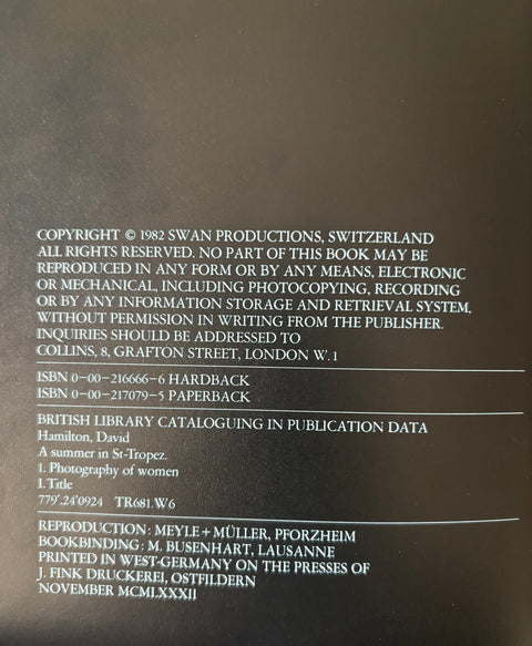 The back cover of a book with white printed copyright and publication information on a dark brown background.