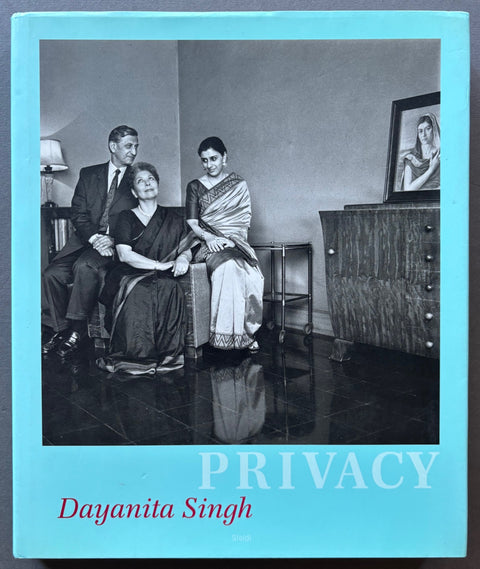 Book titled 'Privacy' by Dayanita Singh with a blue cover featuring a black and white image of the artist with members of her family.