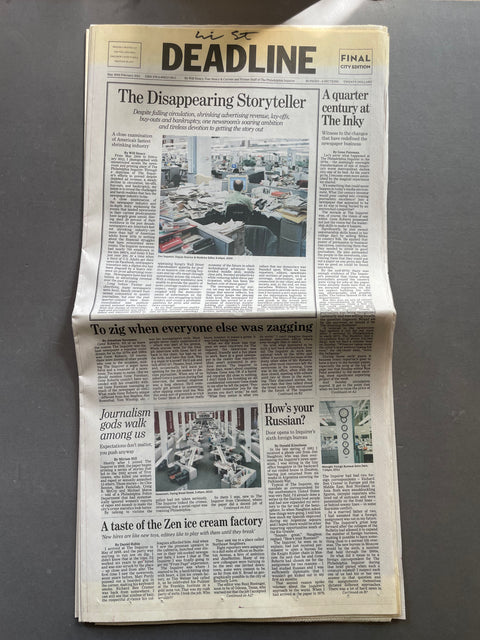 A folded copy of the Deadline newspaper laid flat on a dark gray surface. The front page features the prominent 'DEADLINE' masthead and several articles with photos.