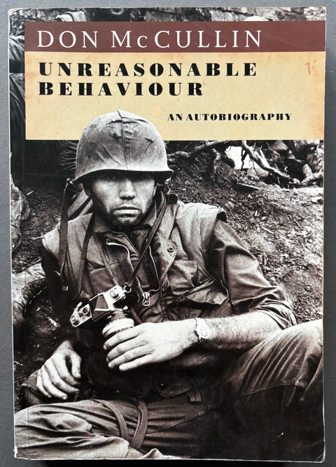 Book titled 'Unreasonable Behaviour' by Don McCullin with a cover featuring an image of the artist himself.