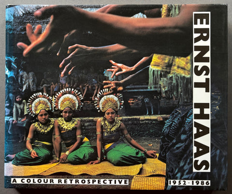 Book titled 'A Color Retrospective' by Ernst Haas with a cover featuring an image of women in tradition dress of their country.