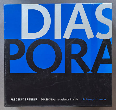 Book titled 'Diaspora: Homelnads in Exile' by Frederic Brenner in a blue, black and white slipcase.