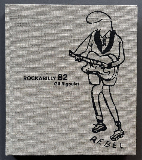 Book titled 'Rockabilly 82' by Gil Rigoulet with a grey cover featuring a drawing of a person playing the guitar.