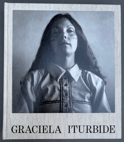 Book titled 'Graciela Iturbide' by Graciela Iturbide with a beige cover featuring a black and white image of the srtist.