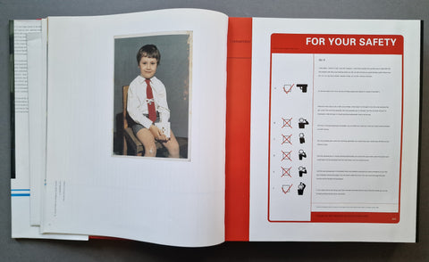 An open book, showing a printed safety page with text and icons on the right and a small inset photo of a child on the left page.