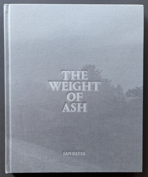 Book titled 'The Weight of Ash' by Ian Bates with a grey cover.