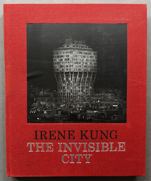 Book titled 'The Invisible City' by Irene Kung with a red cover featuring a tipped in black and white image of the Torre Velasca in Milan.
