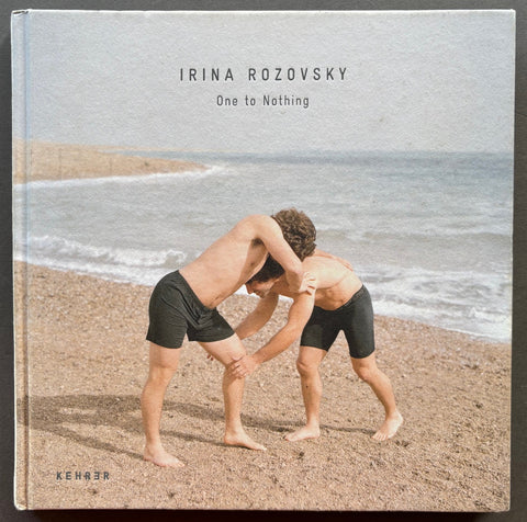 Book titled 'One To Nothing' by Irina Rozovsky with a cover featuring the image of 2 men on a beach.