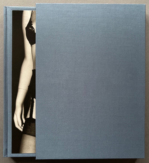 Book titled 'Rei' by Issei Suda with a blue cover featuring a black and white image of a mannequin in lingerie. 