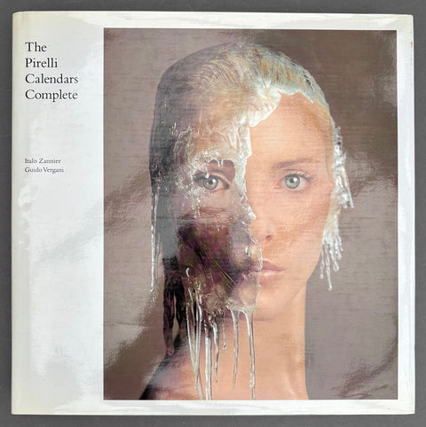 Book titled 'The Pirelli Calendars Complete' by Italo Zannier with a white cover featuring the image of a woman's face half covered in ice.