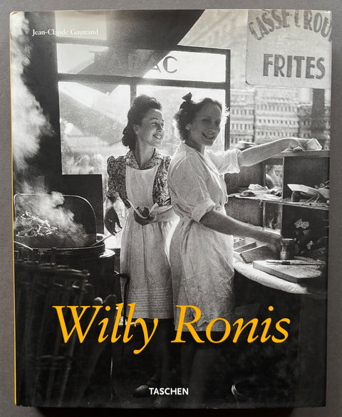 Book titled 'WIlly Ronis' by Jean-Claude Gautrand with a cover featuring a photograph of 2 women working inside a French Tabac.