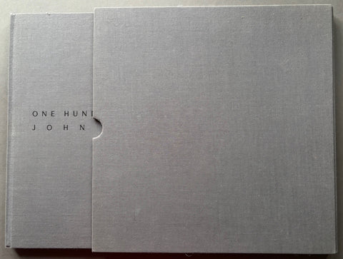 Book titled 'One Hundred Photographs' by John Claridge with a grey cover in a grey slipcase.